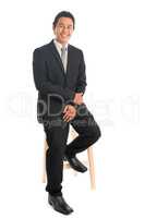 Asian businessman sitting on chair