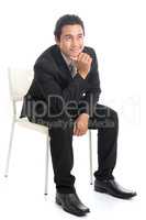 Full body Asian businessman sitting on white chair and thinking