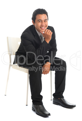 Southeast Asian businessman sitting