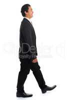 Side view Asian businessman walking