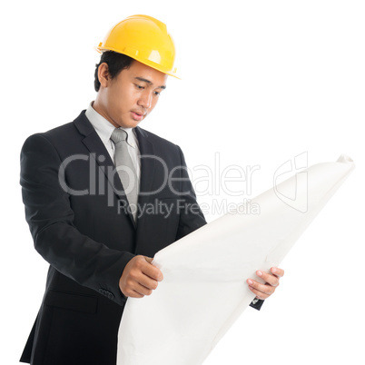 Asian guy with safety helmet and blue prints