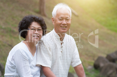 Old Asian couple outdoor portrait.