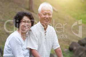 Old Asian couple outdoor portrait.
