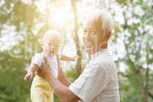 Grandparent and grandchild at park.