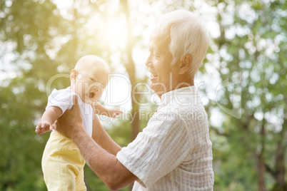 Grandparent and grandchild smiling.