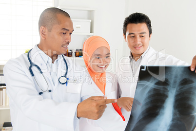 Doctors checking on x-ray image