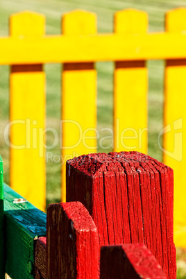 Red wooden post close up.