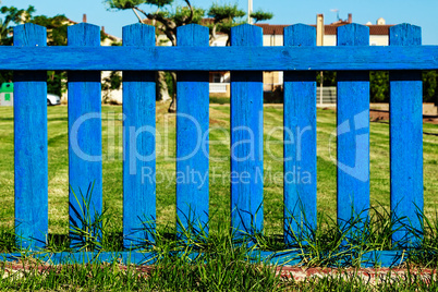 Blue wooden fence.