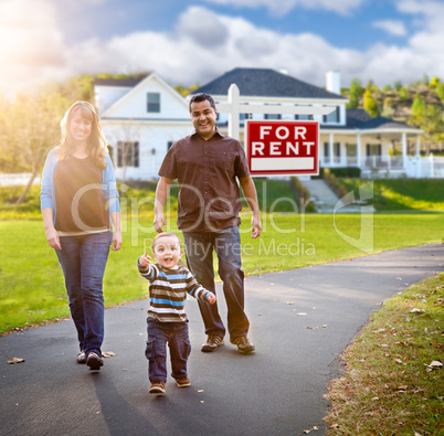 Happy Mixed Race Family Walking in Front of Home and For Rent Re