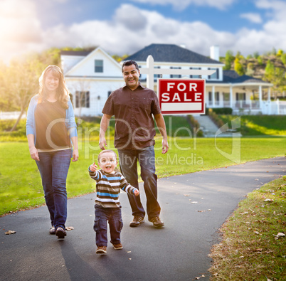 Happy Mixed Race Family Walking in Front of Home and For Sale Re