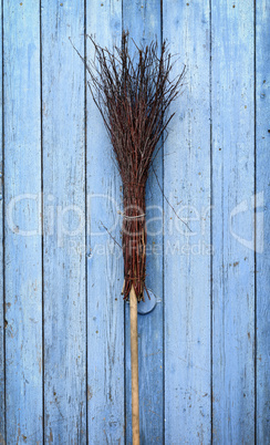 A broom with a wooden handle