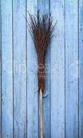 A broom with a wooden handle