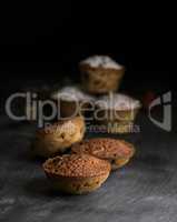 baked cupcakes on a black wooden table