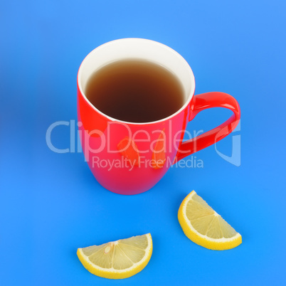Red cup with tea on blue background. Flat lay,top view. Free
