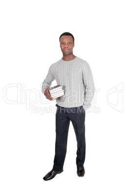 African man standing with books in his hands