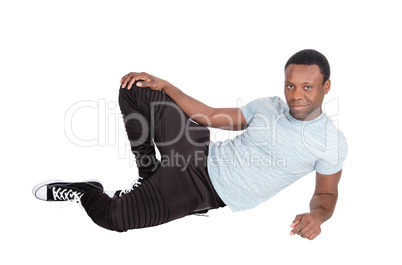 Handsome African man sitting on floor resting