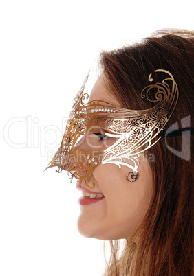 Close up image of woman with gold mask