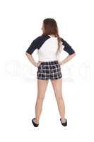 Woman standing in checkered shorts from the back