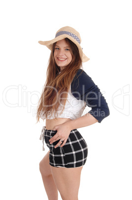 Beautiful woman with a straw hat and black shorts