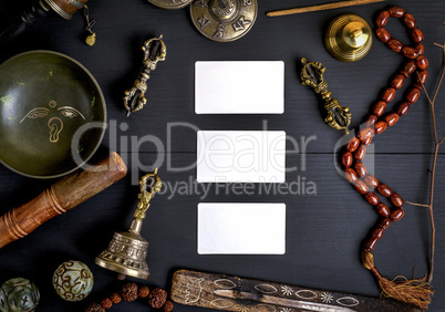 empty white business cards in the midst of Asian religious objec