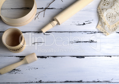 wooden rolling pin and a wooden round sieve