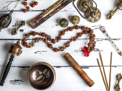 Copper singing bowl, prayer beads, prayer drum, stone balls