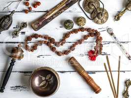 Copper singing bowl, prayer beads, prayer drum, stone balls