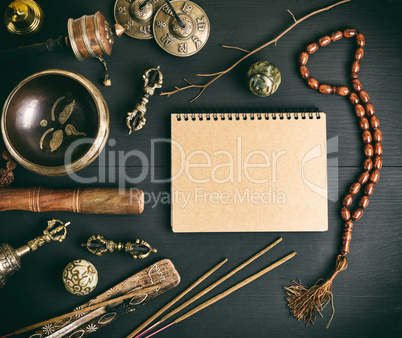 Asian religious musical instruments for meditation and notebook