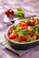 Italian Farfalle pasta with tomatoes and basil