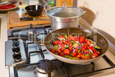 Whole farfalle pasta with zucchini, cherry tomatoes and red onio