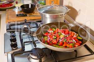 Whole farfalle pasta with zucchini, cherry tomatoes and red onio