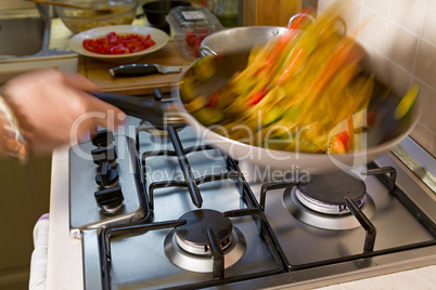 Whole farfalle pasta with zucchini, cherry tomatoes and red onio