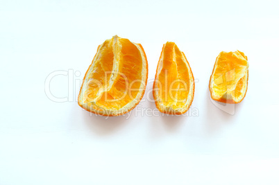 dried slices of orange, three slices of squeezed oranges, sliced of dried orange