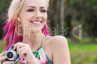 Woman With Blond and Magenta Pink Hair Using Camera
