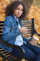 Sad Depressed Mixed Race African American Teenager Using Cell Ph