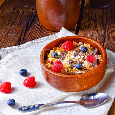 rustic muesli breakfast with forest fruits