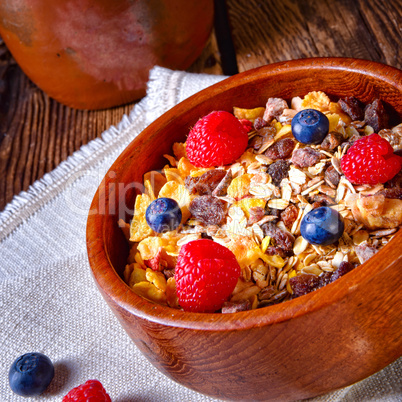 rustic muesli breakfast with forest fruits