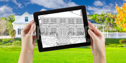 Female Hands Holding Computer Tablet with House Drawing on Scree