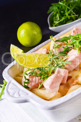 Salmon with penne noodle and arugula