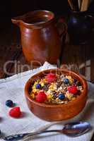 rustic muesli breakfast with forest fruits