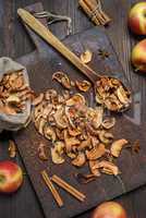 dry apple slices on a brown wooden board