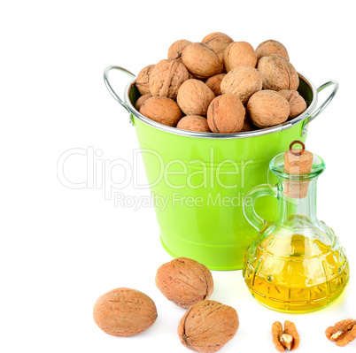 Oil of walnut and nut fruit isolated on white background. Free s