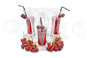 Cherry and glass of juice isolated on white background.