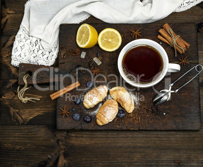 white ceramic mug with hot black tea