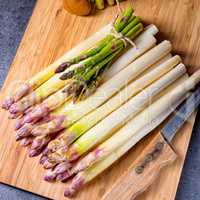 white and green asparagus on kitchen board