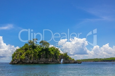 Rocky Island with Forest, Blue Sky and Beautiful Clouds