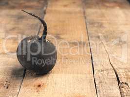 Organic black radish on a rustic wooden table