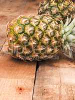 Organic pineapples on wood