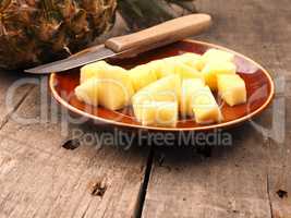 Sweet organic pineapple on wood