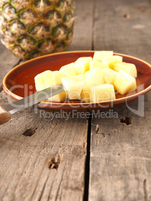 Sweet organic pineapple on wood